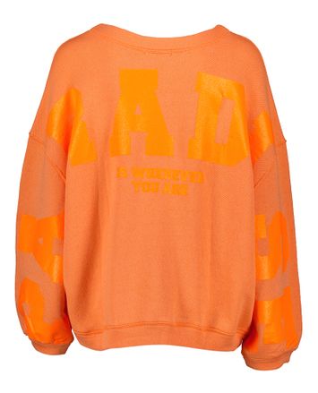 Oranje kleurige oversized sweater met opschrift op de achterkant Sky Paradise Liv Bergen