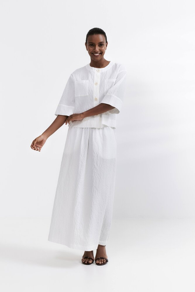 Ecru bloes met knopen en opgestikte zakken HER