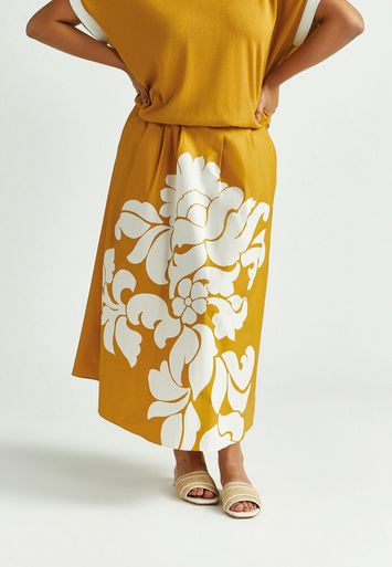 Okergele plooirok met witte bloemenprint Rila Xandres 