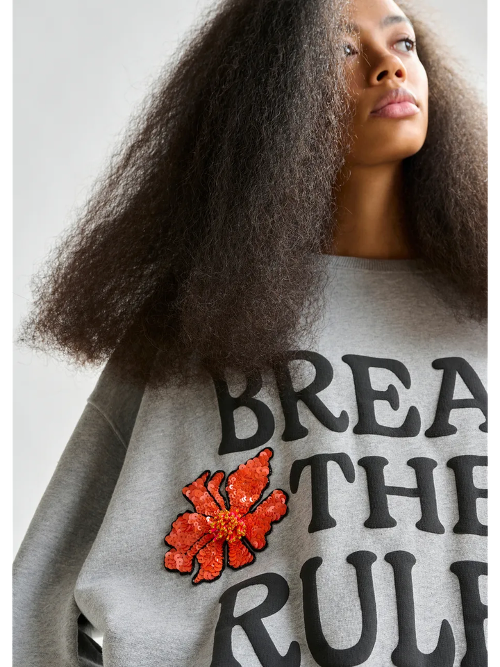 Grijze en zwarte sweater met oranje pailletten Ixpperience Essentiel