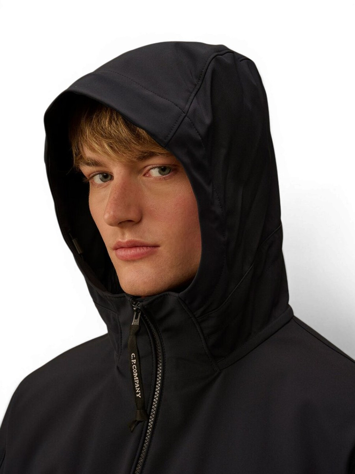 Zwarte jas met kap logo CP Company