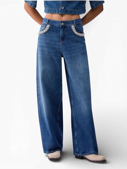 Blauwe uitlopende jeans met stenen applicaties Liu Jo