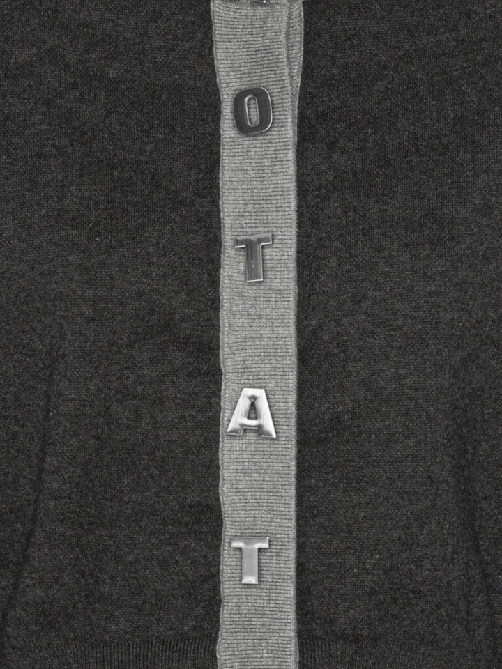 Blauwe gilet met zilveren letters Rotate