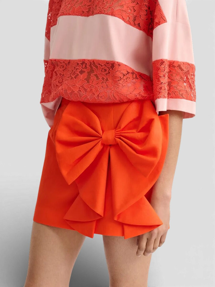Oranje korte rok met strik Essentiel