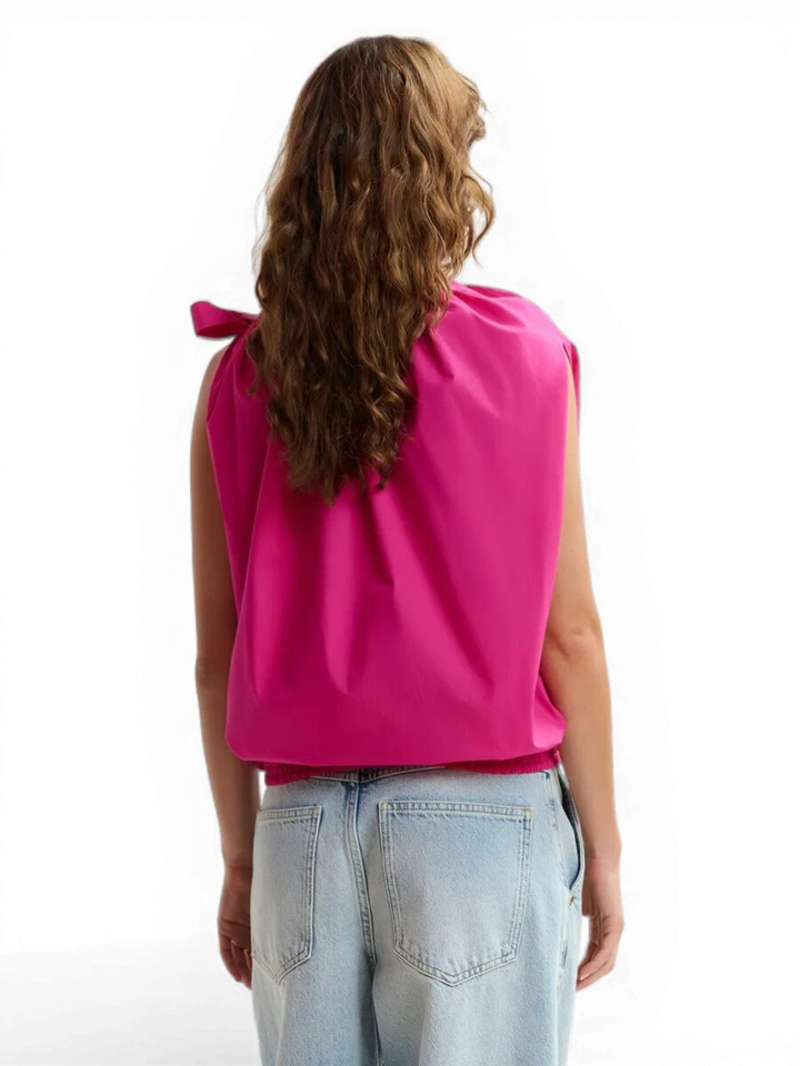 Roze asymmetrische top met strikje Jaylah Essentiel