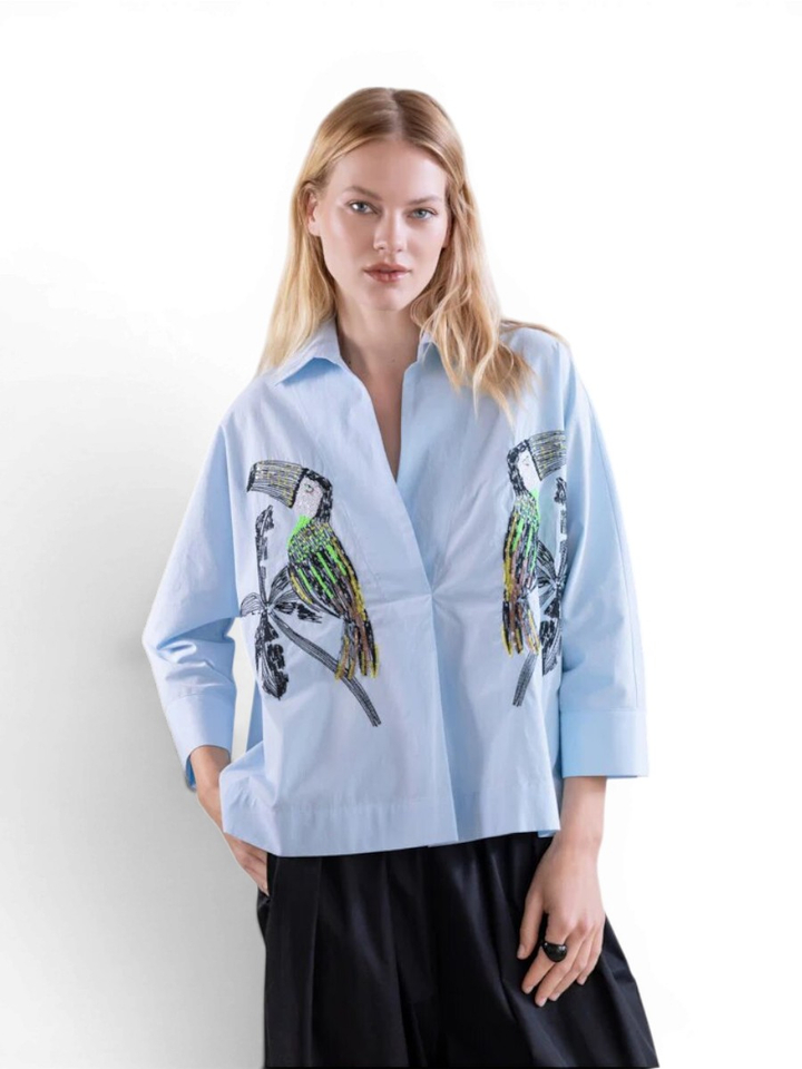 Blauwe blouse met print Psophia