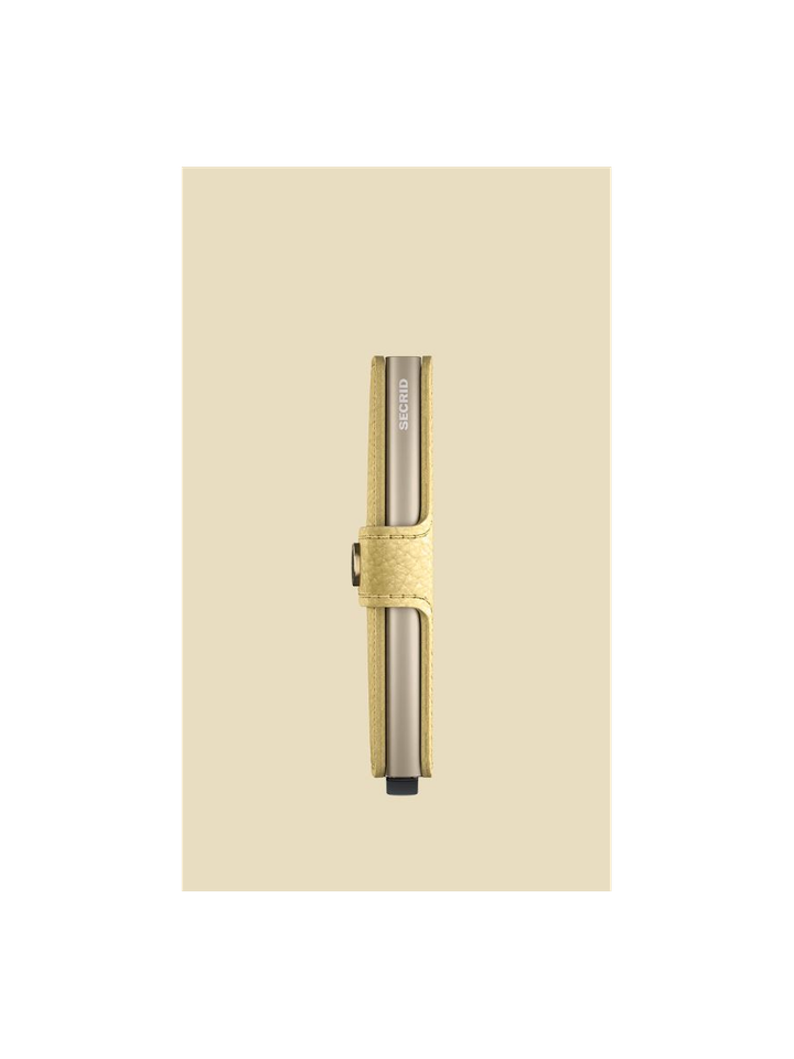 Butter yellow mini pebble Secrid 