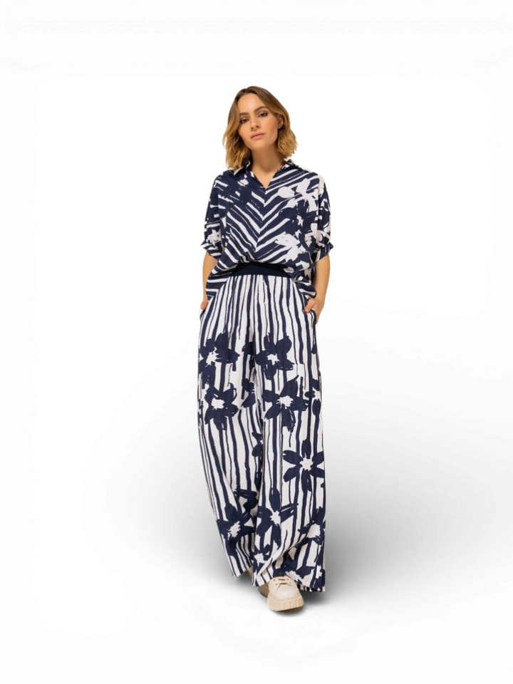 Blauwe gestreepte broek met bloemenprint Caroline Biss 