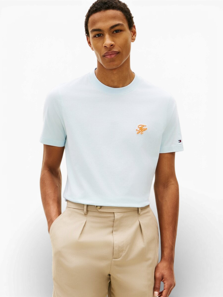 Lichtblauwe t-shirt met oranje logo Tommy Hilfiger 