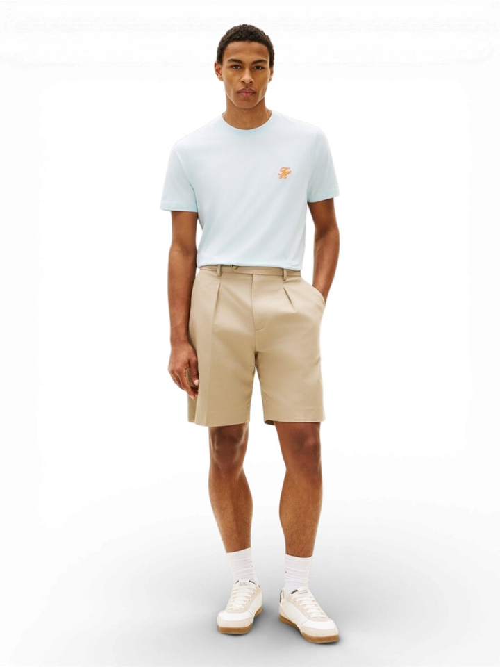 Lichtblauwe t-shirt met oranje logo Tommy Hilfiger 