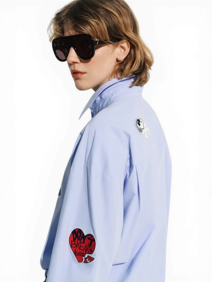 Lichtblauw katoenen shirt met veelkleurige Peanuts Snoopy-patches Jarlie Essentiel