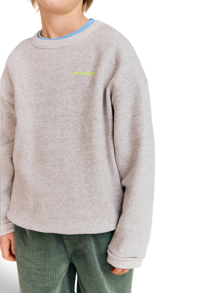 Grijze sweater met zwarte spikkels en fluo detail AO