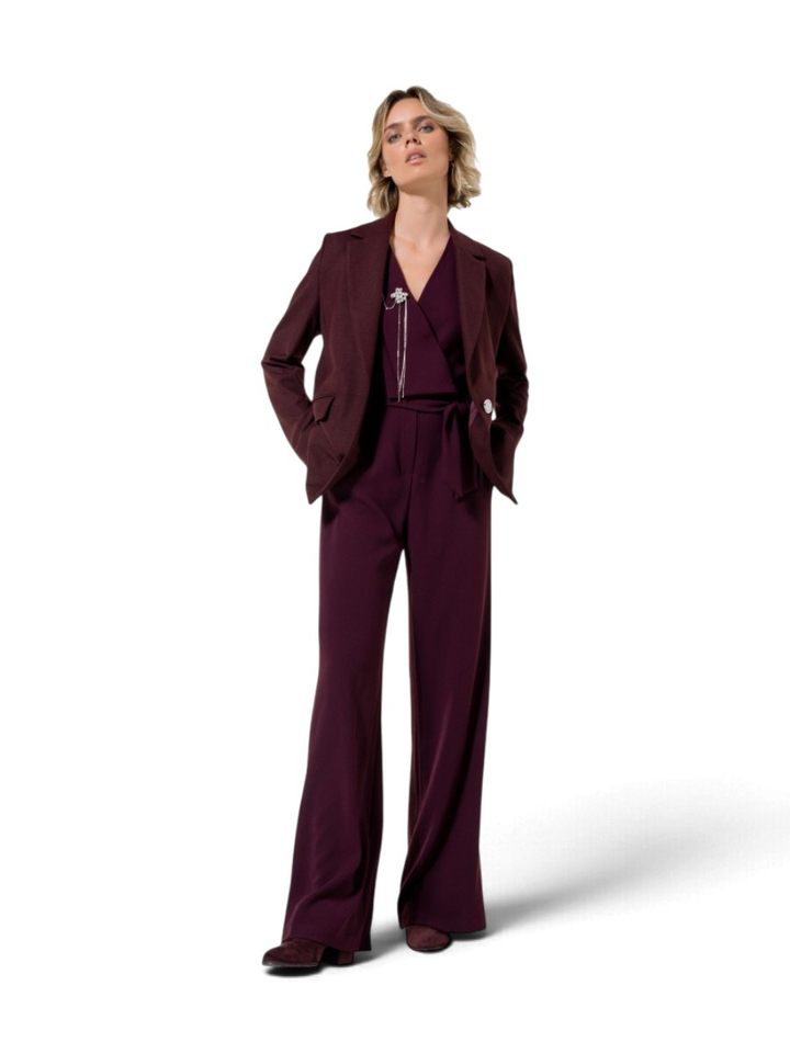 Aubergine jumpsuit met kettingdetail Caroline Biss